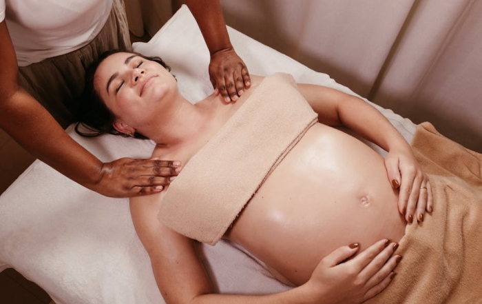 Pregnant woman enjoying a soothing prenatal massage in a spa. Relaxation and pampering at its best.